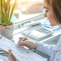Patient filling out information to assist with treatment costs