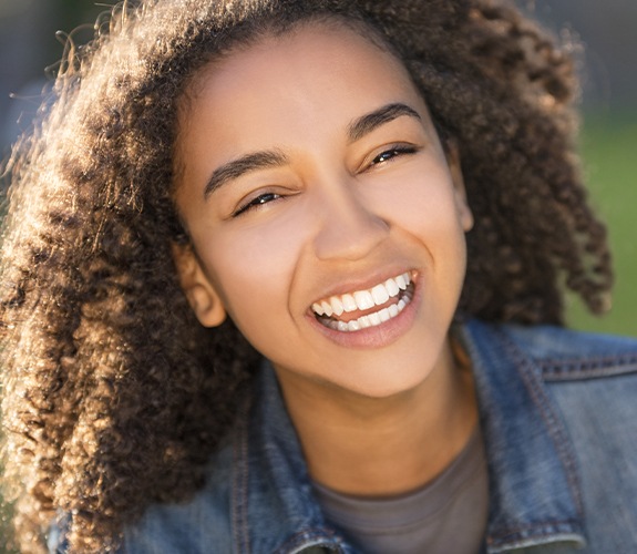 girl smiling outside