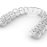 Basic clear aligner pictured against gray and white background