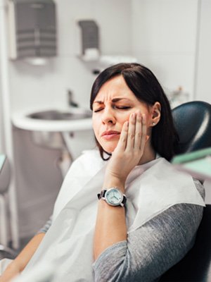 Woman at the dentist with tooth pain