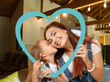 woman and child smiling in Aurora