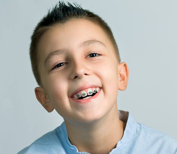 young boy with braces
