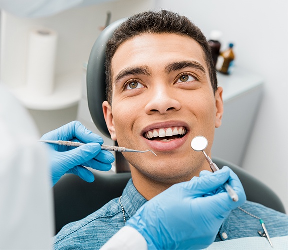 handsome man getting dental checkup