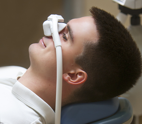 man with nitrous oxide mask on