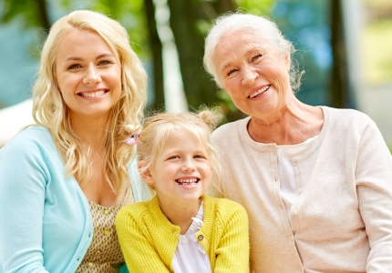 two woman and a girl smiling