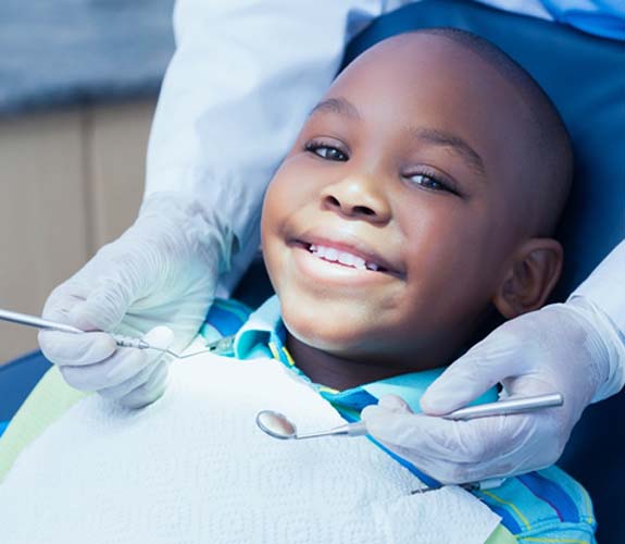 Young boy in dental chair receiving special needs dentistry in Aurora, IL