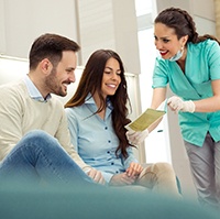 Couple learning about the cost of teeth whitening