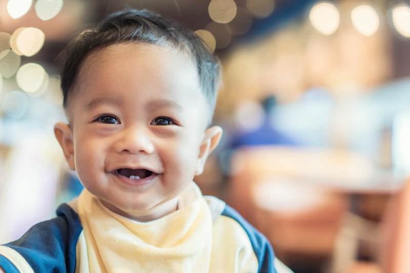 Little boy with two front lower baby teeth