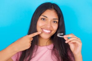 teenager with Invisalign clear aligners