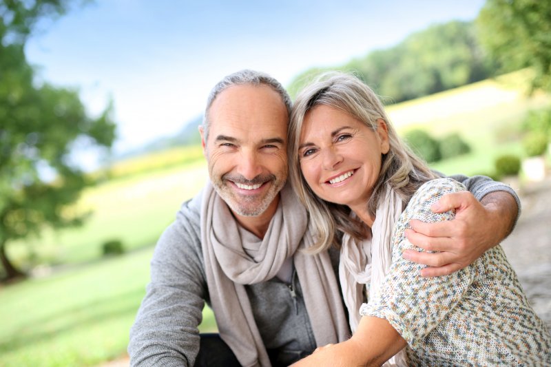 couple with dental implants