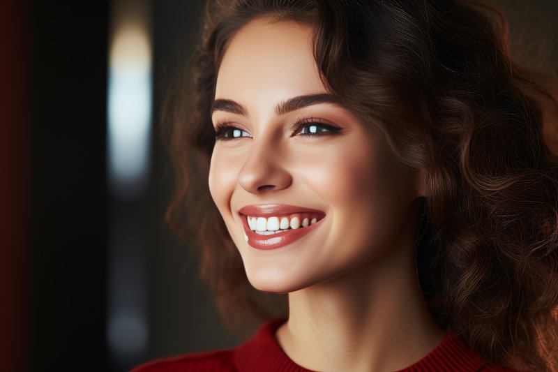 a woman showing off her veneers